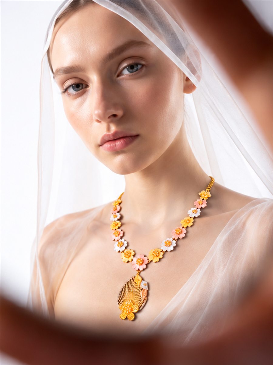 Warm editorial photograph of gold jewellery